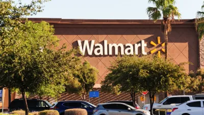 Front of Walmart store with sign.